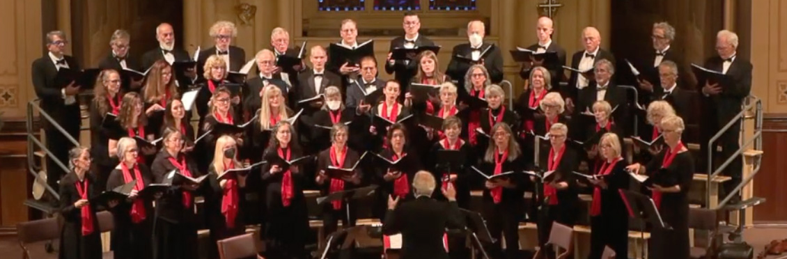 The Santa Cruz Chorale sing onstage in holy cross church
